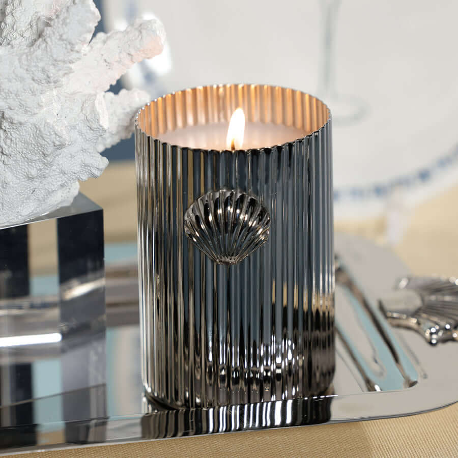 Cap Ferrat Fan Shell Design Candle in Gift Box displayed elegantly on a silver tray with coral decor.