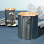 Cap Ferrat Fan Shell Design Candle in Gift Box displayed with fluted metal vessel and sea salt fragrance.