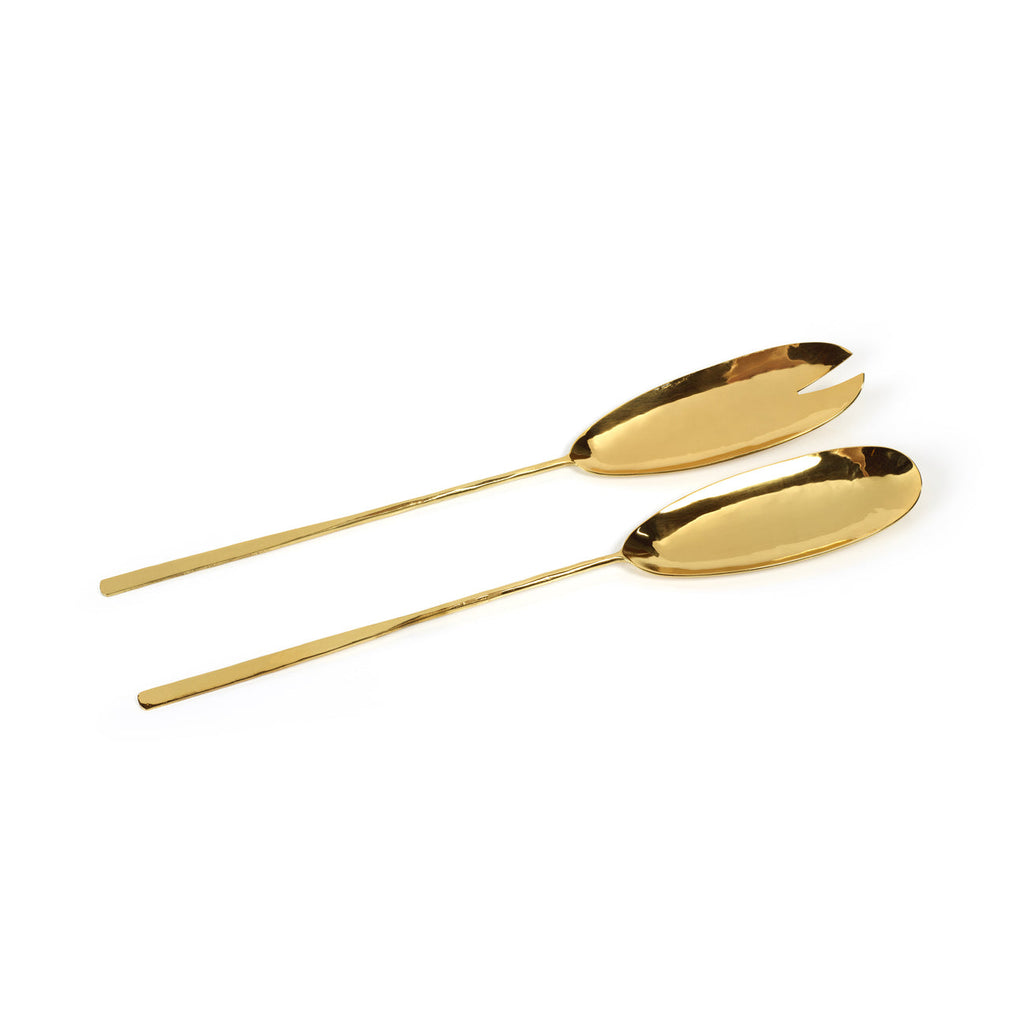 Two gold spoons on a white background