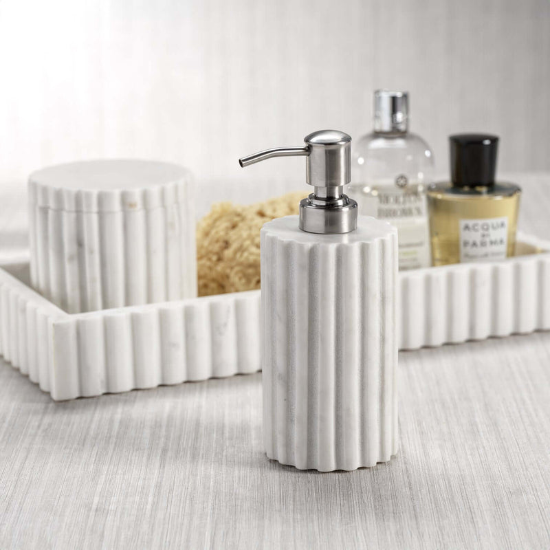 Camogli Bath Collection soap dispenser featuring solid white marble with sculpted vertical fluting.