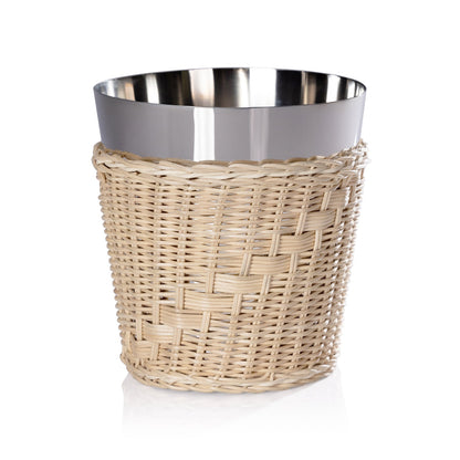 The Palmier Wine and Champagne Bucket with handwoven rattan exterior and polished steel interior, displayed on a white surface.