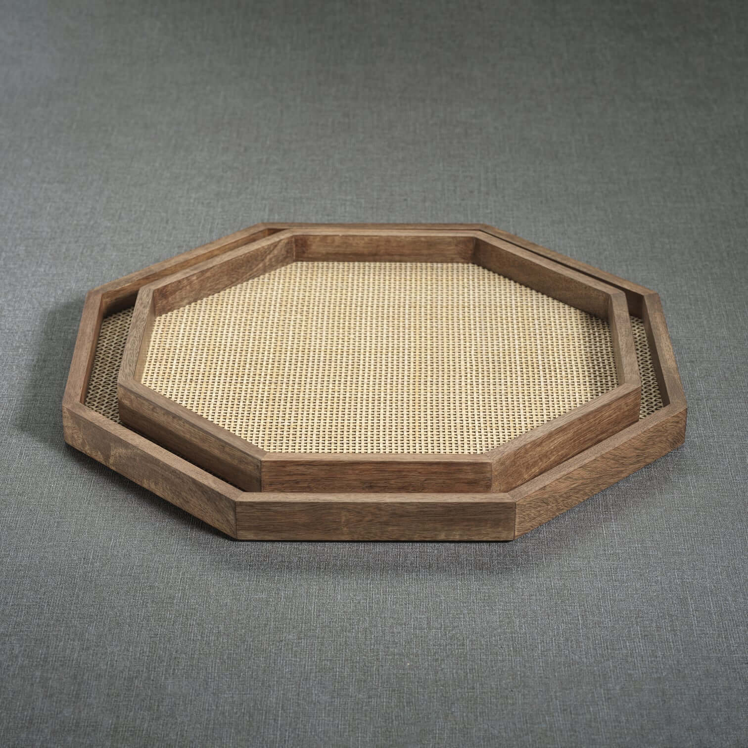 The Marais Tray features an octagonal mango wood design with woven rattan inlay, showcasing artisanal craftsmanship.