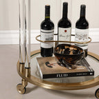 Opus Round Bar Cart / Trolley - Small with wine bottles and decorative bowl on mirrored glass surface.