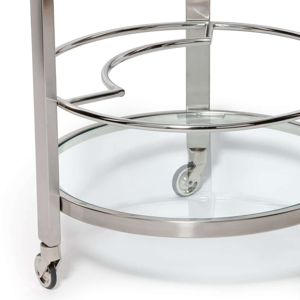 Élan Round Bar Cart / Trolley featuring polished chrome finish and glass shelves for contemporary entertaining.
