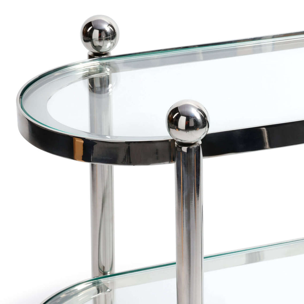 Close-up of Three-Tier Étagère showing polished silver frame and clear glass shelves.