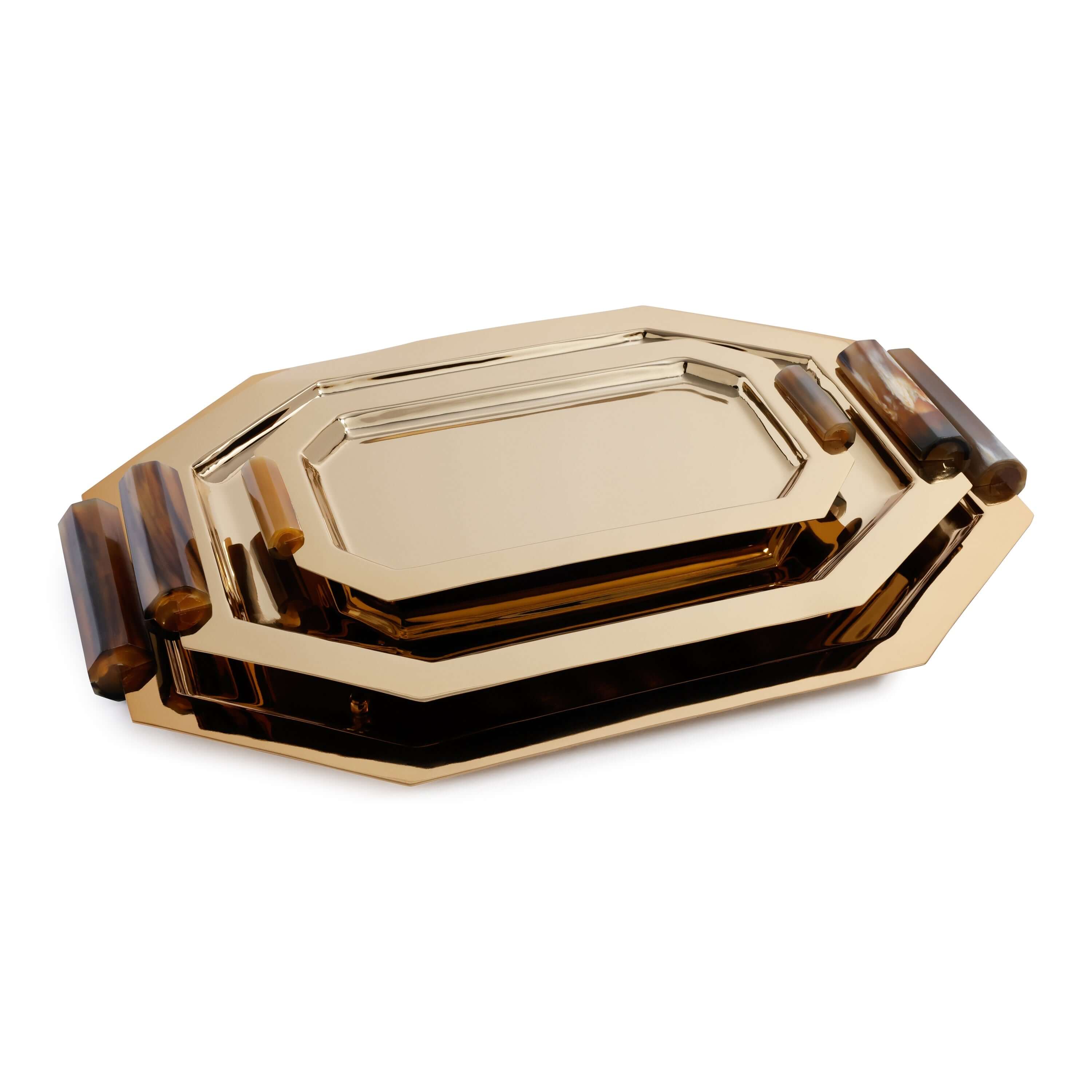 Set of gold and brown trays on a white background