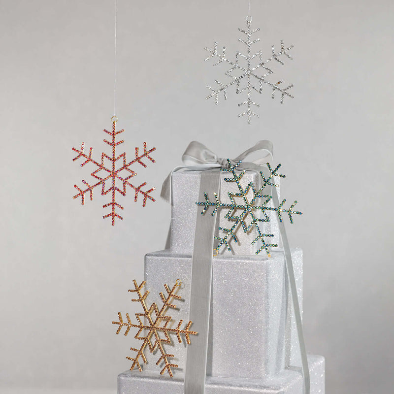 Decorative snowflake ornaments on a gray background