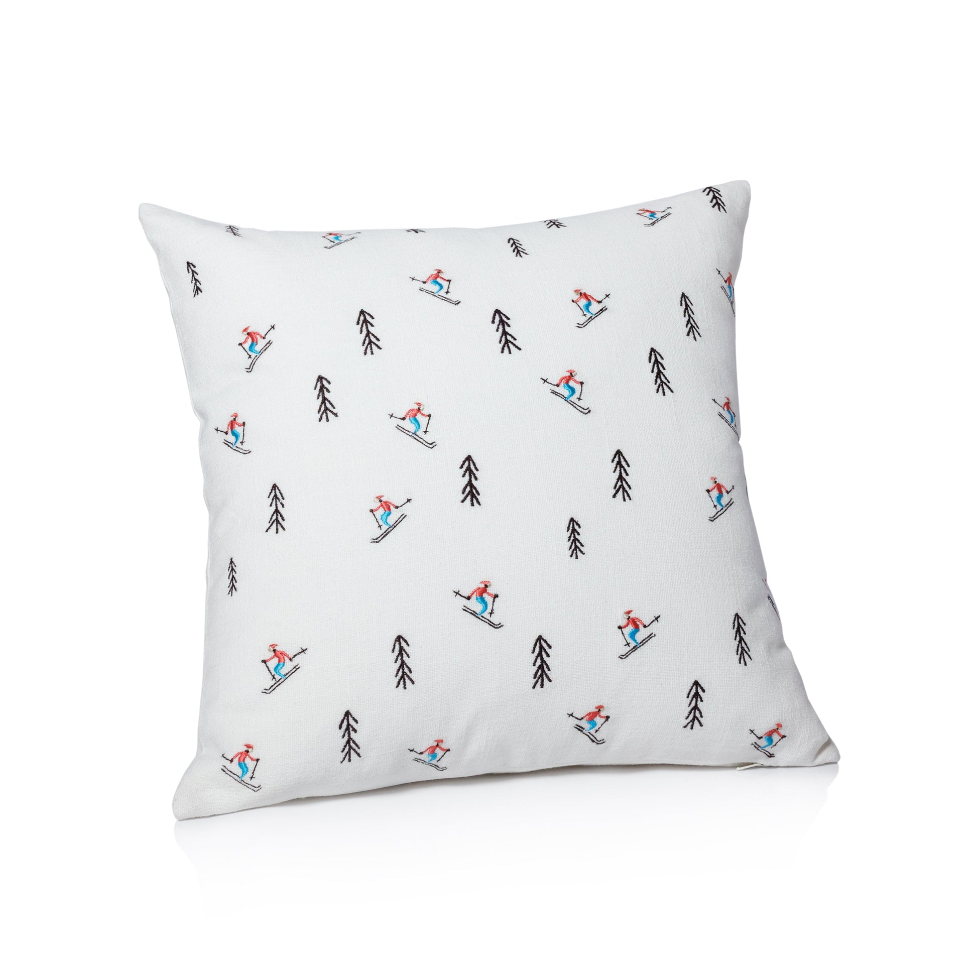 Decorative pillow with skiing pattern on a white background