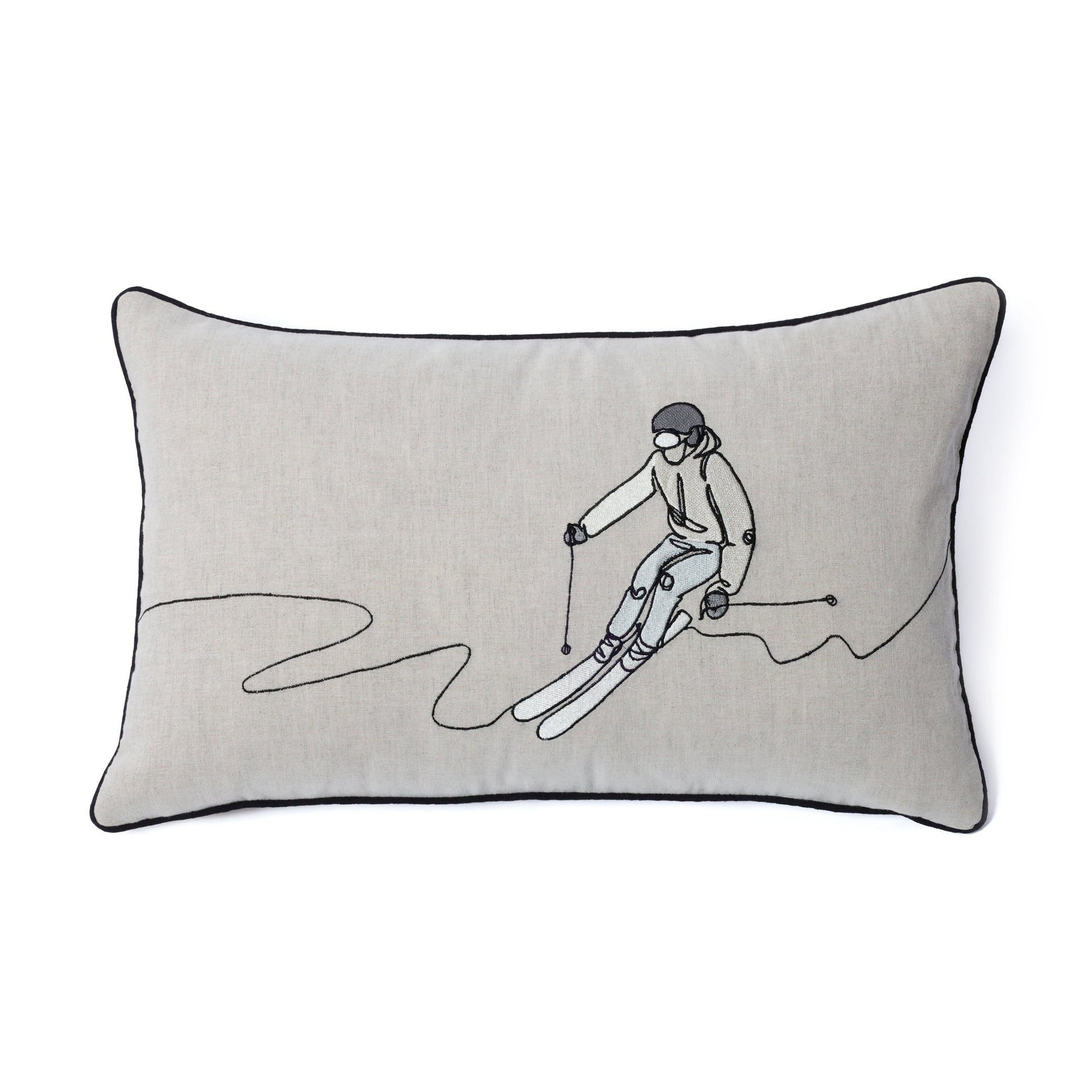 Decorative pillow with a skier design on a plain background