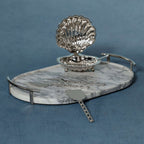Luze Oval Marble Tray with stainless steel handles, stylish marble serving piece for appetizers or cocktails.