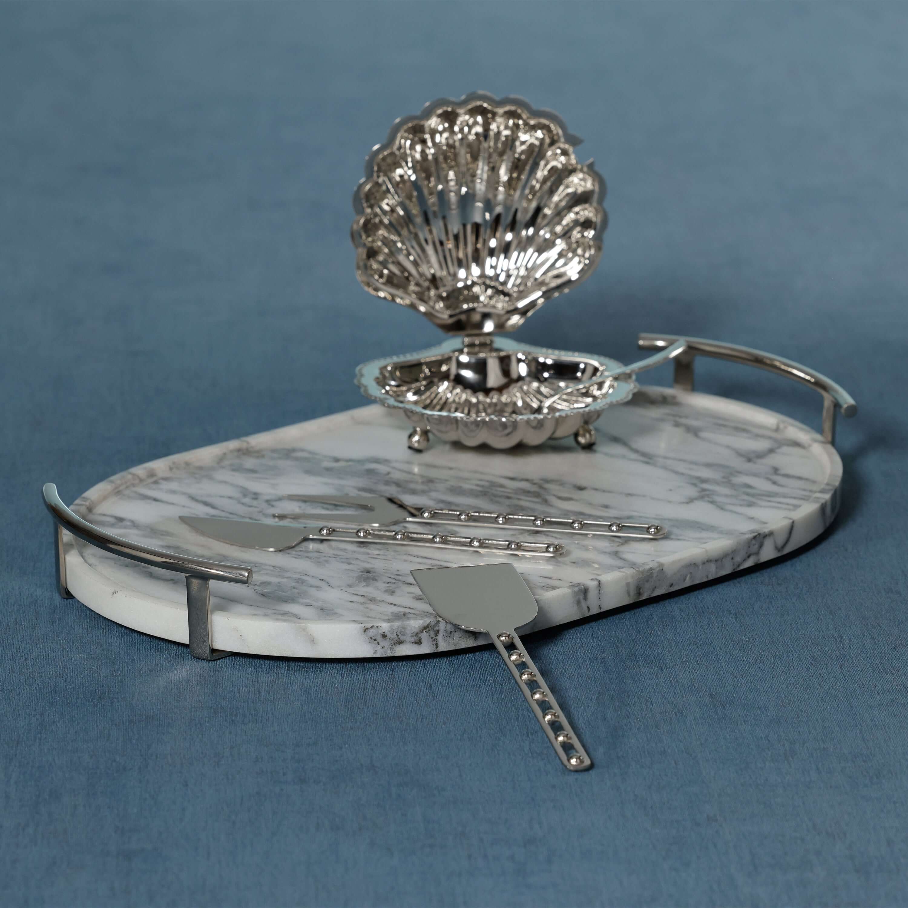 Luze Oval Marble Tray with stainless steel handles, stylish marble serving piece for appetizers or cocktails.