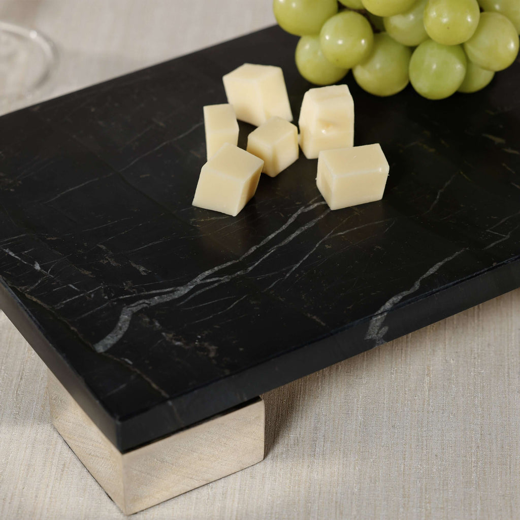 Roku Cheese and Charcuterie Marble Serving Tray with cheese cubes and grapes on black marble surface.