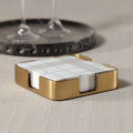 Gold Cocktail Napkin Holder featuring a satin brushed gold finish and geometric design with napkins inside.