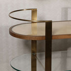 Sloane Oak Wood Oval Bar Cart with antique brass-finished steel frame and clear glass top.