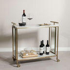 Soho Marble Bar Cart with white marble top, brass frame, and wine glasses, set against a light background.