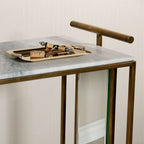 Soho Marble Bar Cart featuring a brass tray and marble top, perfect for stylish home entertaining.