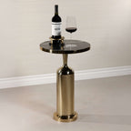 Nomad Table with nero marquina marble top, polished gold rim, and brass-finish pedestal base, perfect for modern decor.