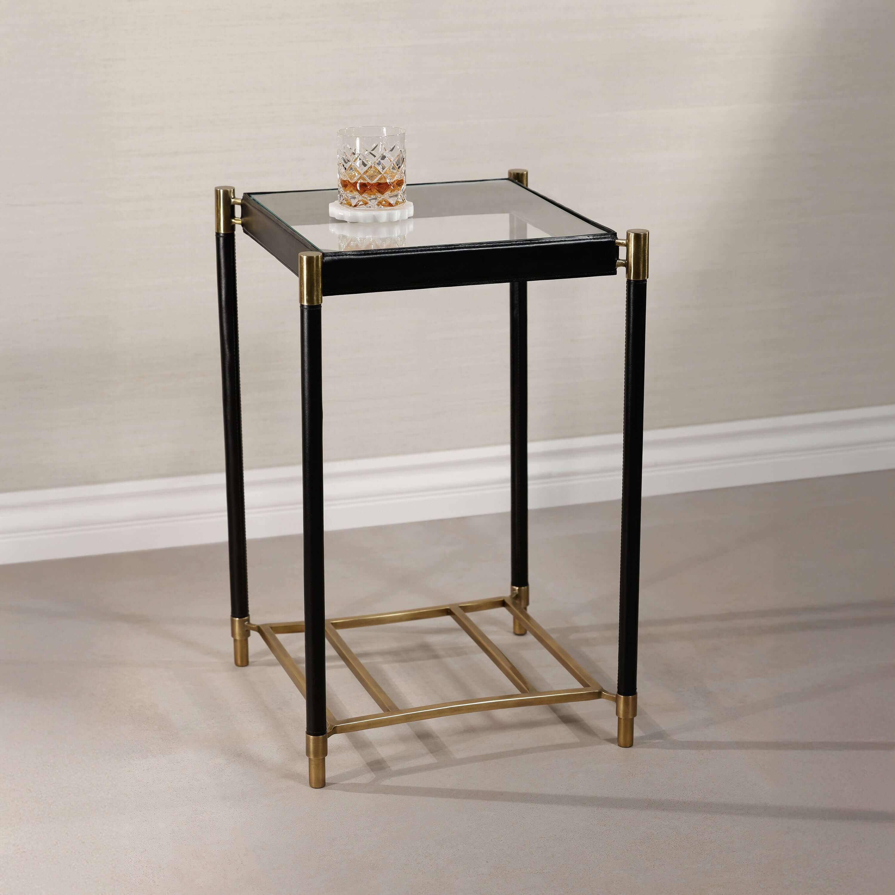 Elegant Park Lane 18 Leather Side Table with glass top, black leather legs, and brass accents.