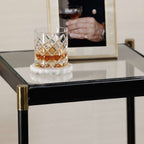 Park Lane 18 Leather Side Table featuring a glass top, leather edges, brass fittings, and a whiskey glass.