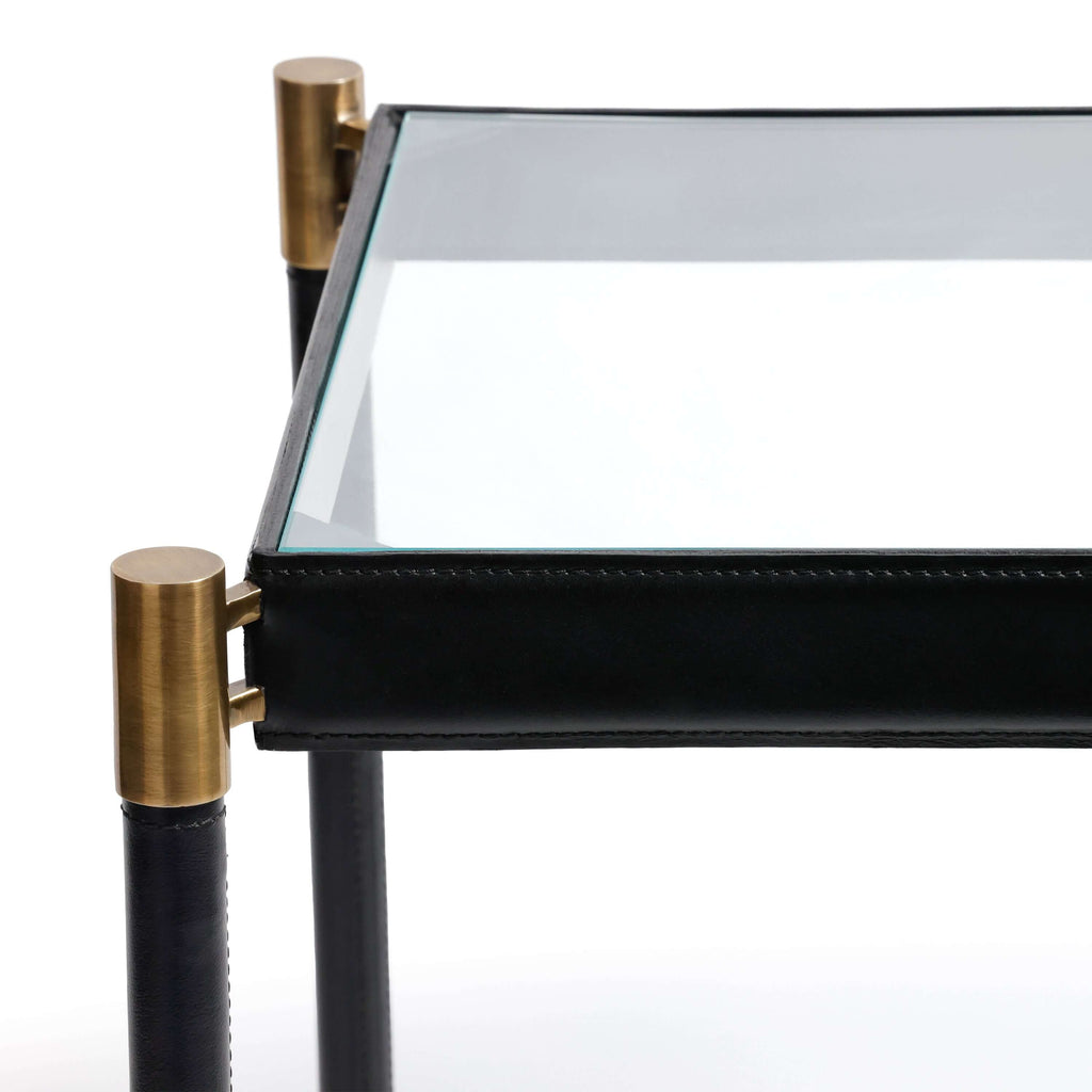Park Lane 18 Leather Side Table close-up showcasing saddle-stitched black leather and brass collar fittings.