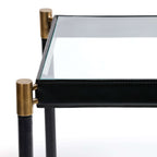 Park Lane 18 Leather Side Table close-up showcasing saddle-stitched black leather and brass collar fittings.