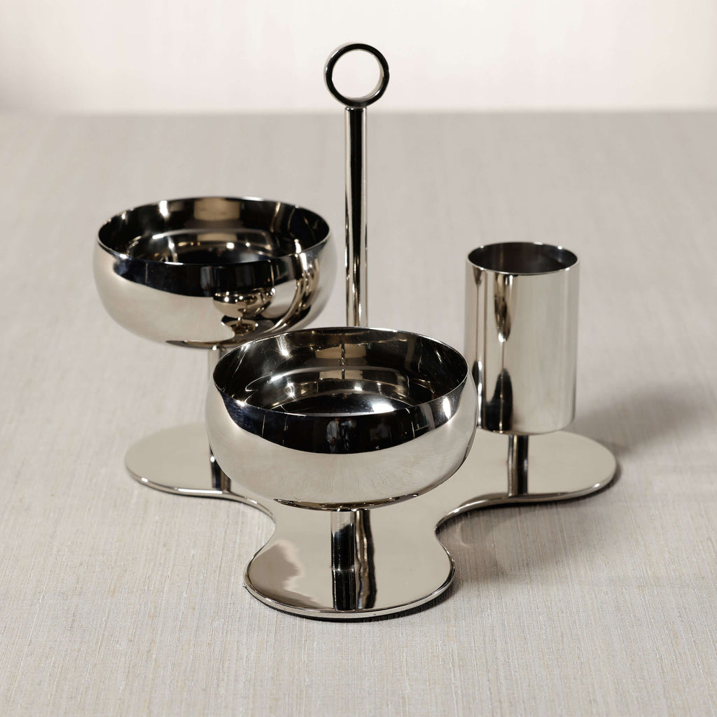 Locarno 3-Tier Condiment Set - PREORDER featuring polished bowls and a cylindrical holder on a sculptural base.