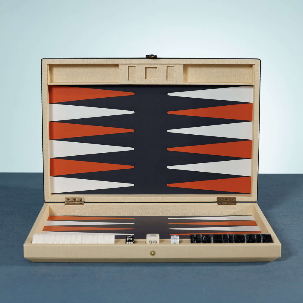 Monaco 19" Backgammon Set with burnt orange and white points on a deep graphite background, woven raffia case.