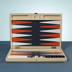 Monaco 19" Backgammon Set with burnt orange and white points on a deep graphite background, woven raffia case.
