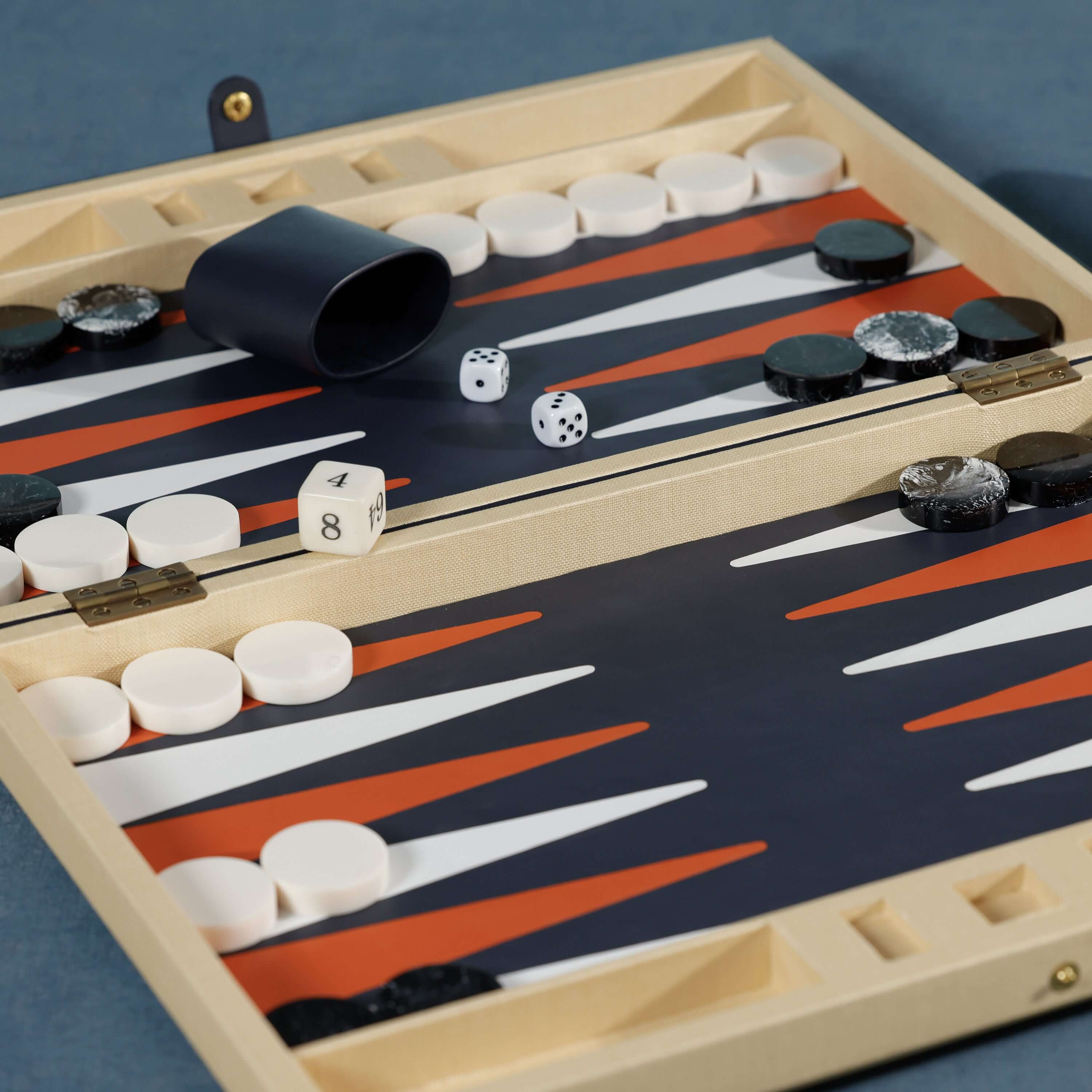 Monaco 19" Backgammon Set with dice and playing pieces on a stylish board, showcasing its elegant design.