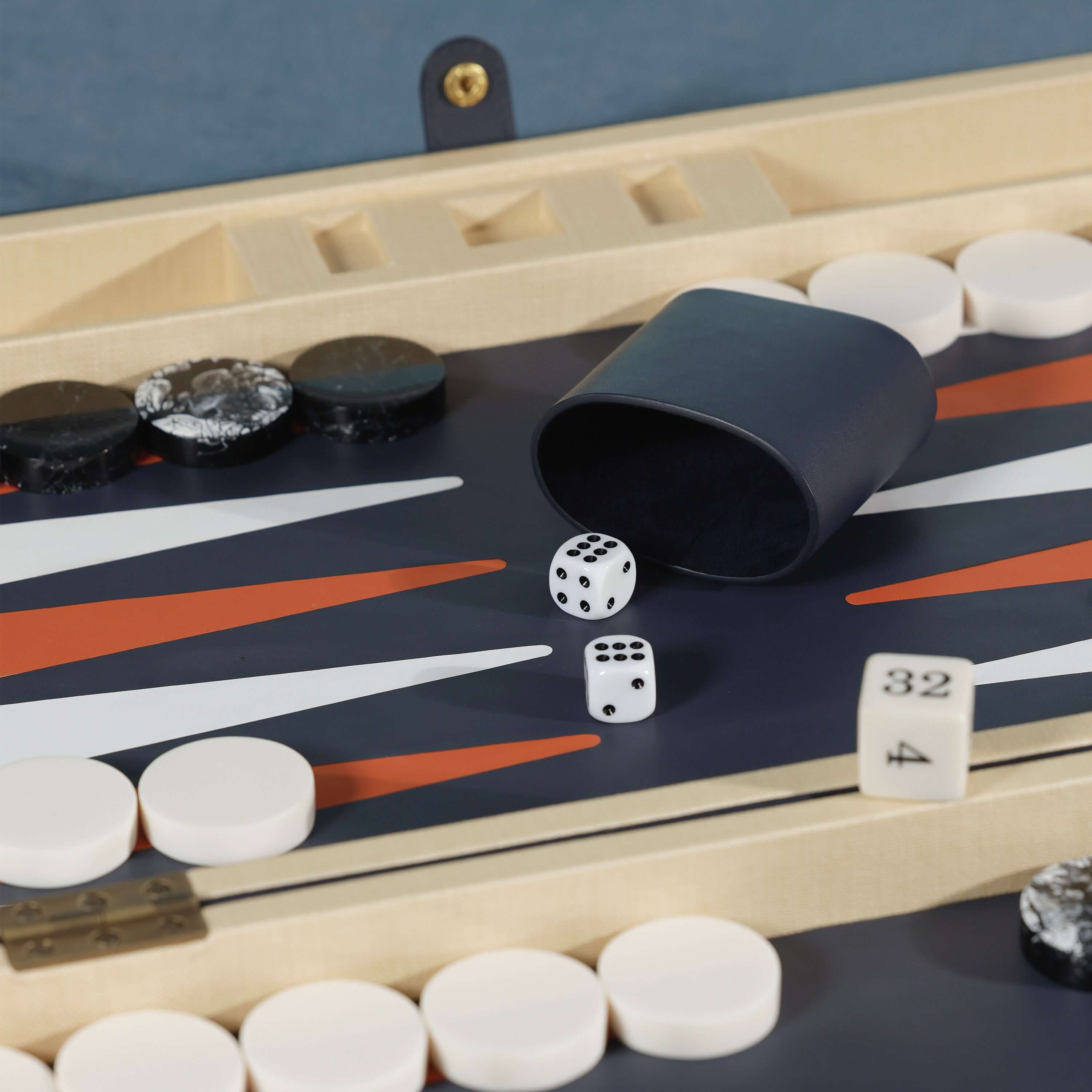 Monaco 19" Backgammon Set featuring dice and checkers on a stylish playing field.