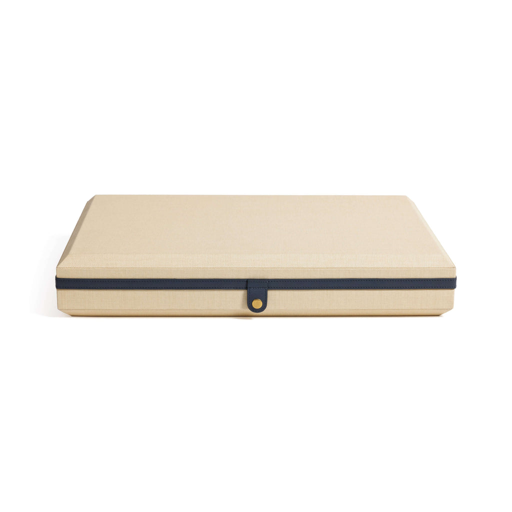 Monaco 19" Backgammon Set in a natural raffia case with leather edging and brass stud closure.