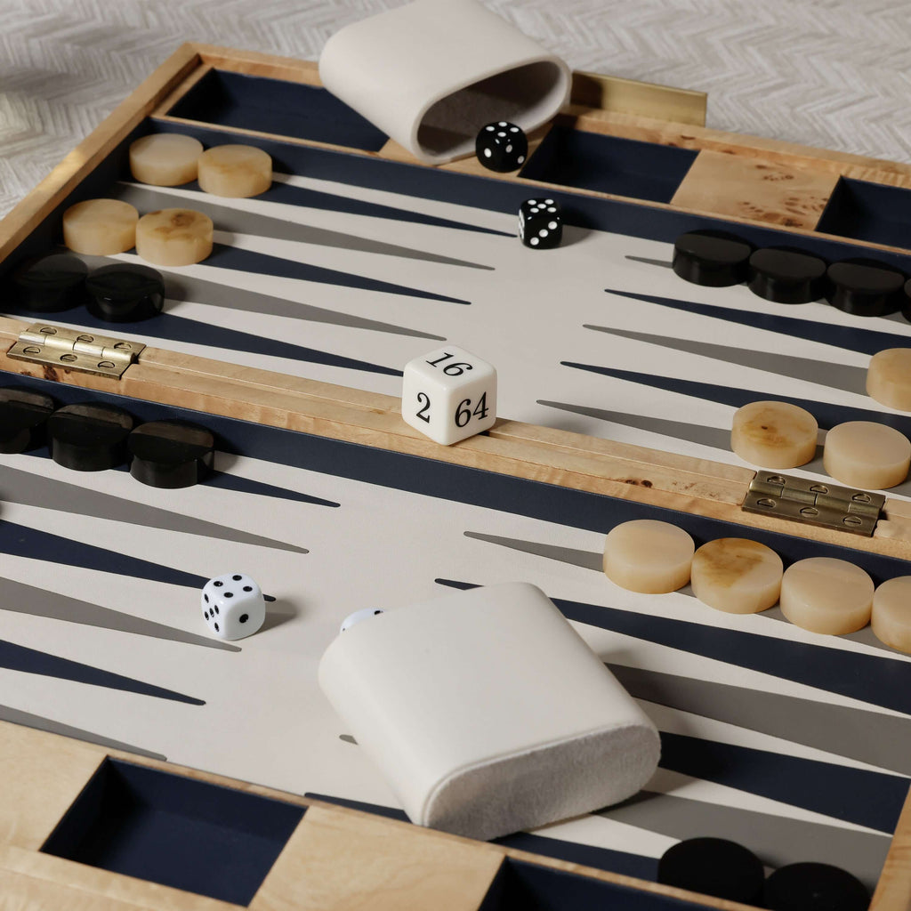 Marbella Backgammon Set with burl wood veneer, chic design, dice, and game pieces on a stylish board.