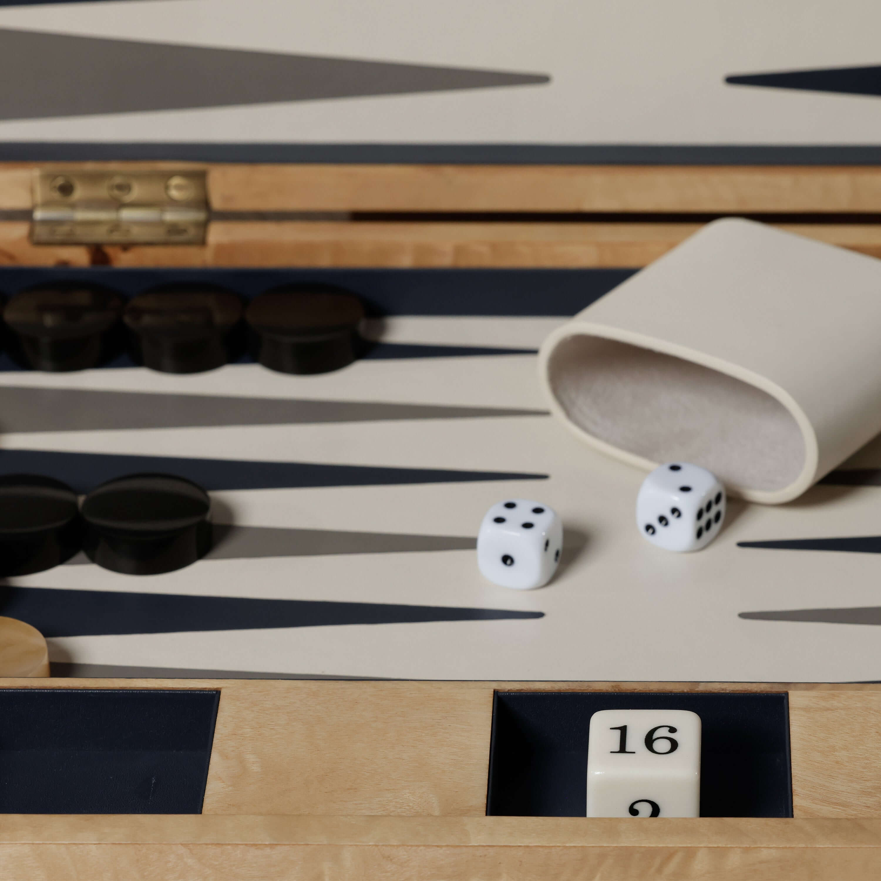Marbella Backgammon Set featuring dice, game pieces, and a burl wood veneer case.