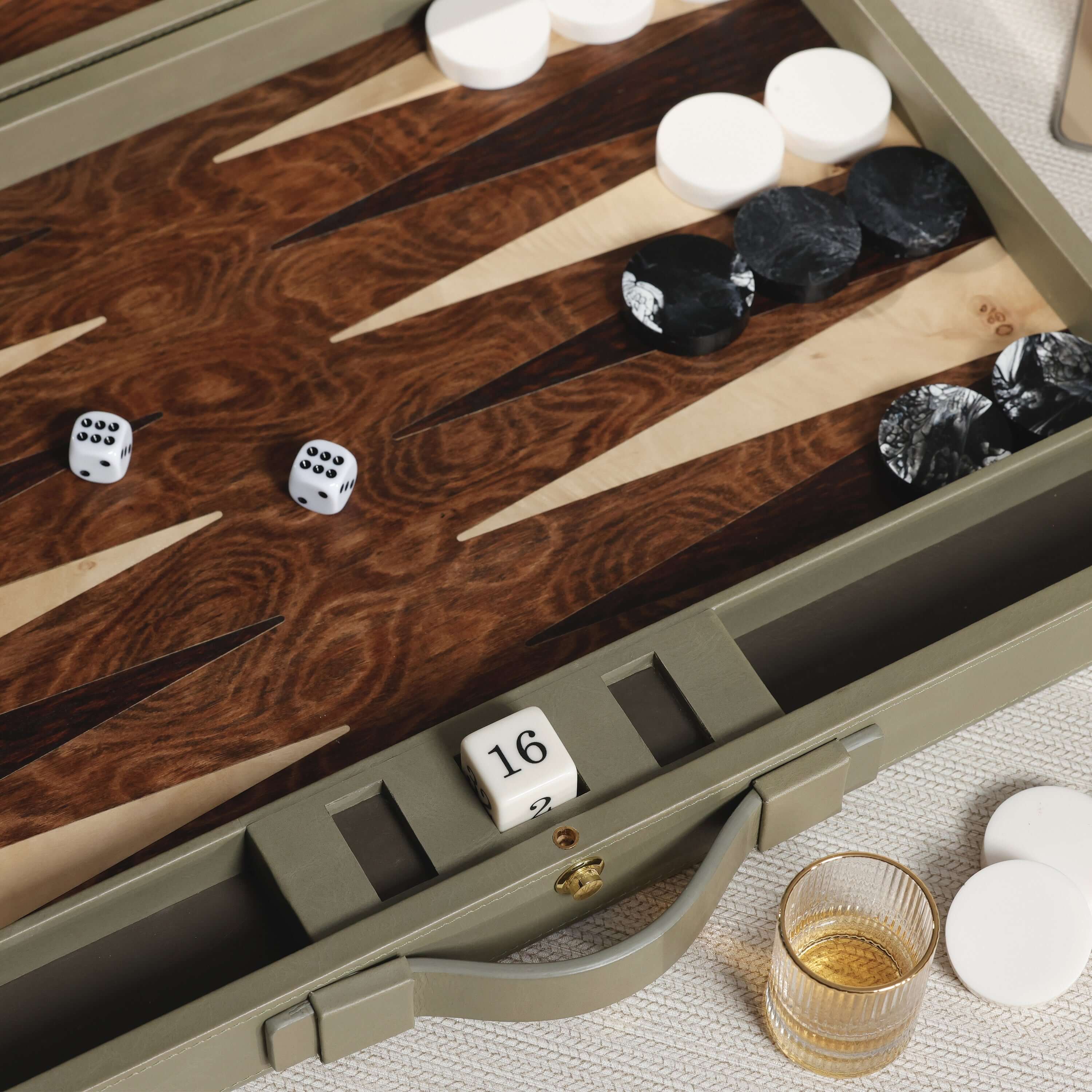 Geneva 19" Backgammon Set - Dusty Green Leather with dice and game pieces on a wooden surface.