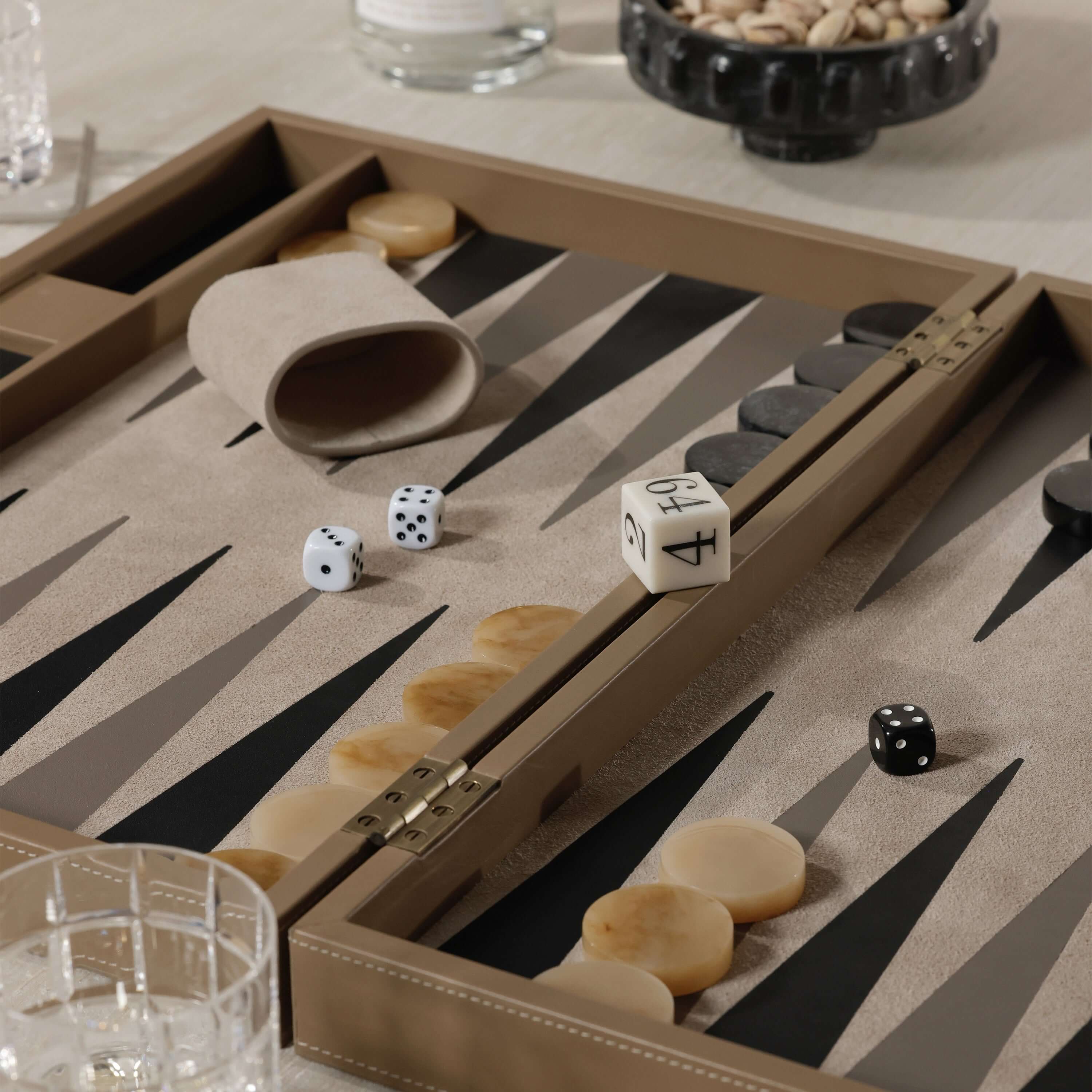 Geneva 19" Backgammon Set - Taupe Leather with dice and game pieces in a stylish arrangement.