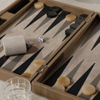 Geneva 19" Backgammon Set - Taupe Leather game board with dice and pieces on a smooth surface.
