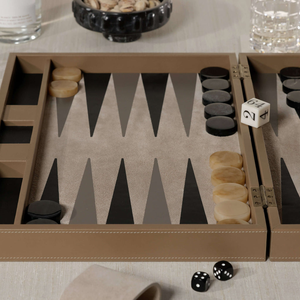 Geneva 19" Backgammon Set - Taupe Leather with game pieces and dice on a stylish table.