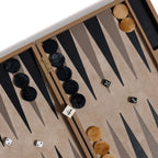 alt_tag: Geneva 19" Backgammon Set - Taupe Leather game board showing tan and black pieces with dice.