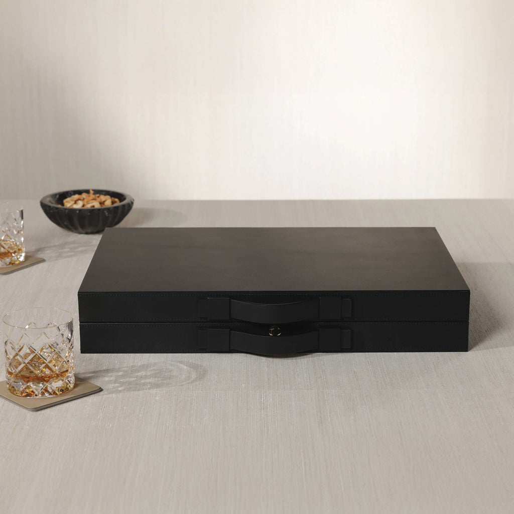 Geneva 19" Backgammon Set - Midnight Black Leather sleek matte finish with brass clasp on a table.