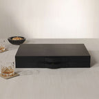 Geneva 19" Backgammon Set - Midnight Black Leather sleek matte finish with brass clasp on a table.