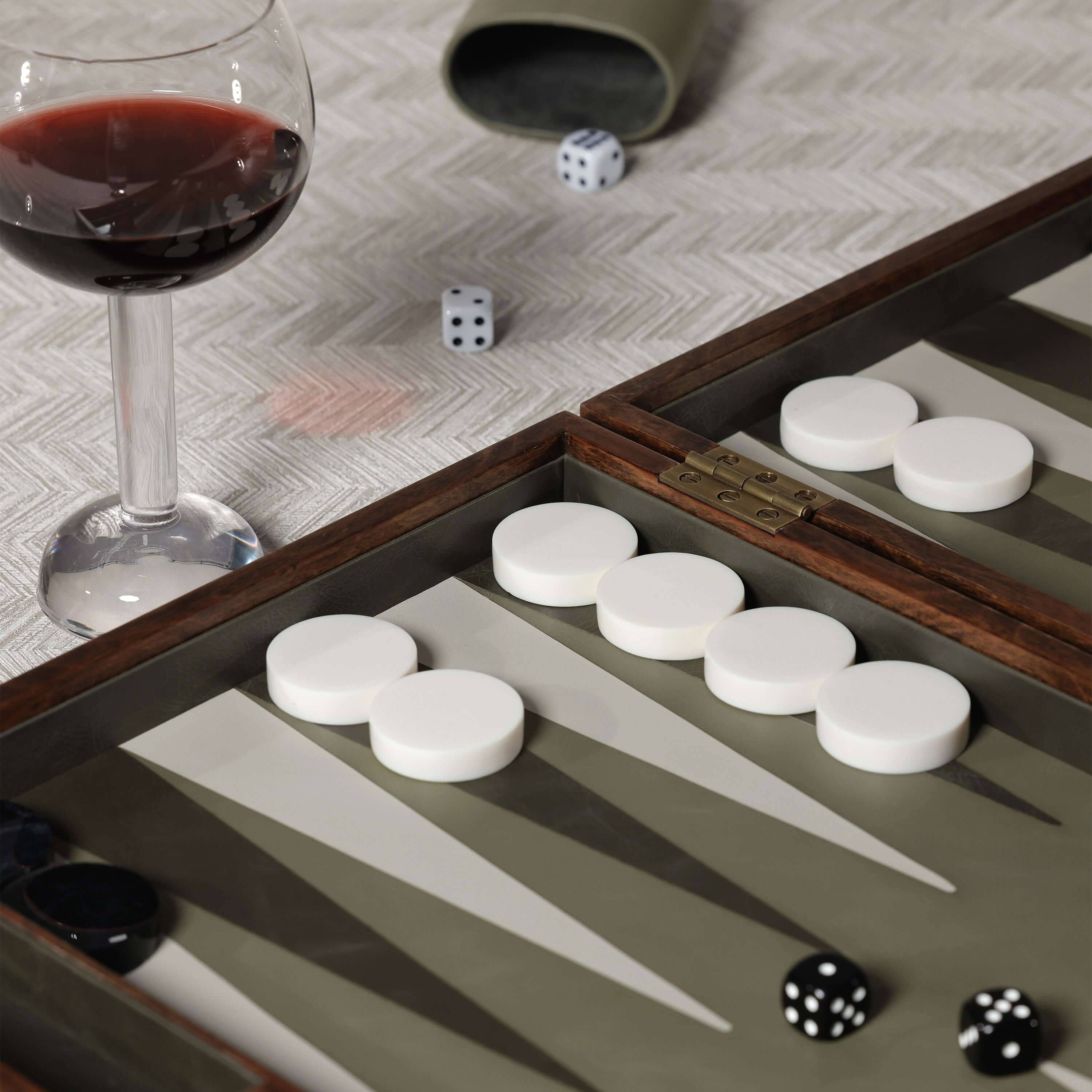 Palma de Mallorca 19" Backgammon Set with wine glass and dice on a textured table.