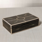 The Corinthia Box showcasing elegant deep charcoal shagreen with cream resin border and dense textured surface.