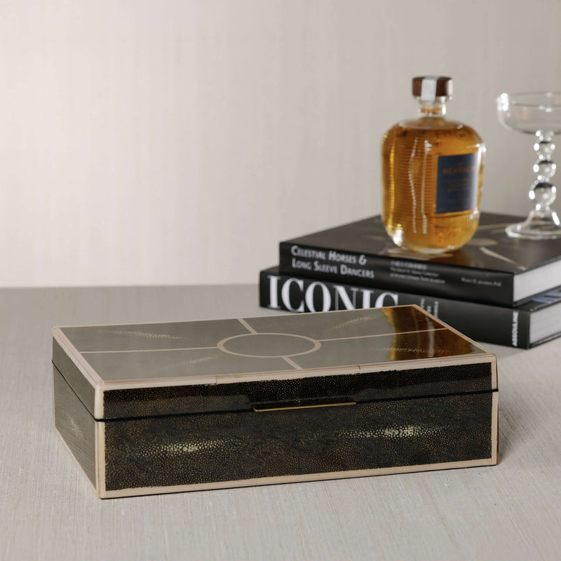 The Corinthia Box featuring deep charcoal shagreen texture and cream resin border on a stylish table setting.