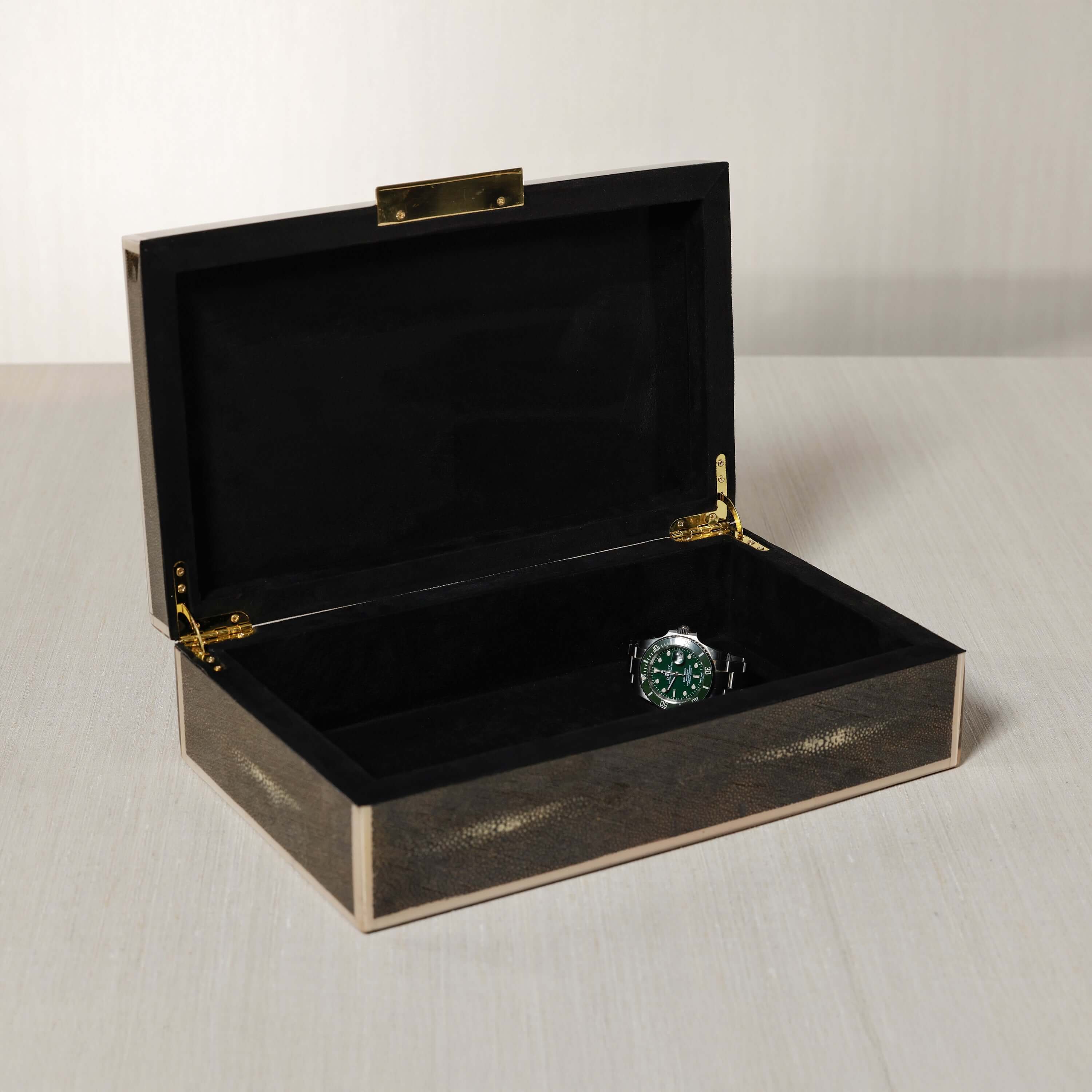 The Corinthia Box showcasing rich charcoal shagreen and a watch inside, highlighting its elegant design.