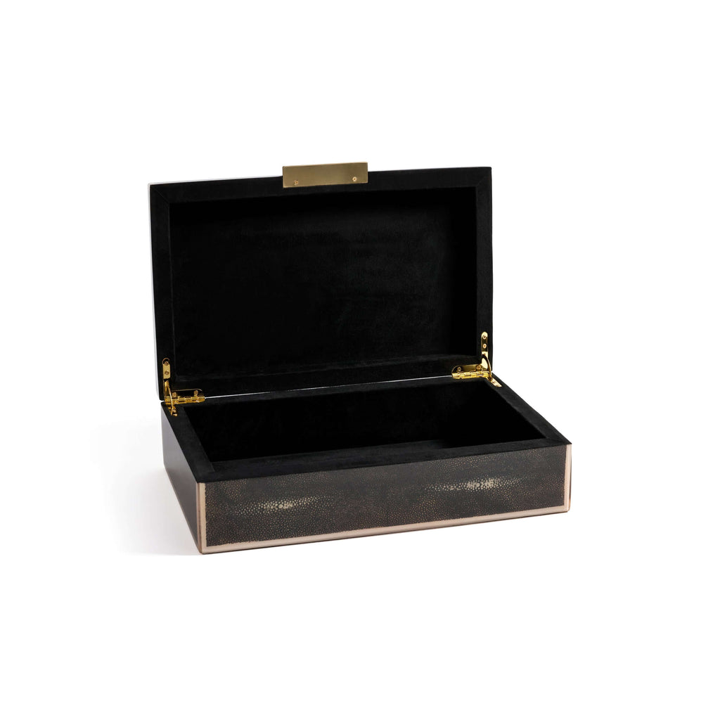 The Corinthia Box features deep charcoal shagreen with a cream resin border and elegant brass hardware.