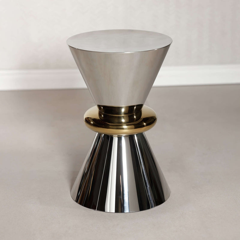 Edition Polished Side Table featuring a polished stainless steel hourglass design with a gold ring accent.