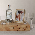 Sur Mer Shell Design Bottle Coaster with tequila bottle and glasses on a stylish tabletop.