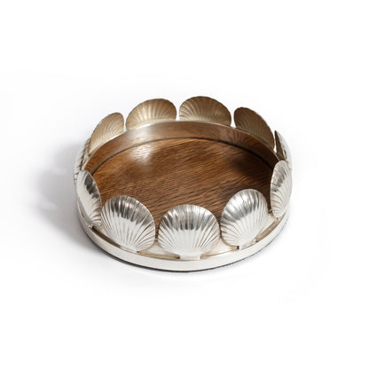 Decorative bowl with wooden center and metallic shell-like edges on a white background