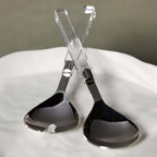 Mougins Salad Server Set with Acrylic Handle features polished stainless serving heads and crystal-clear handles.