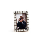 Lagos White Bone & Chiseled Horn Inlaid Photo Frame displaying a photo of a man with a camera, featuring geometric chevron design.